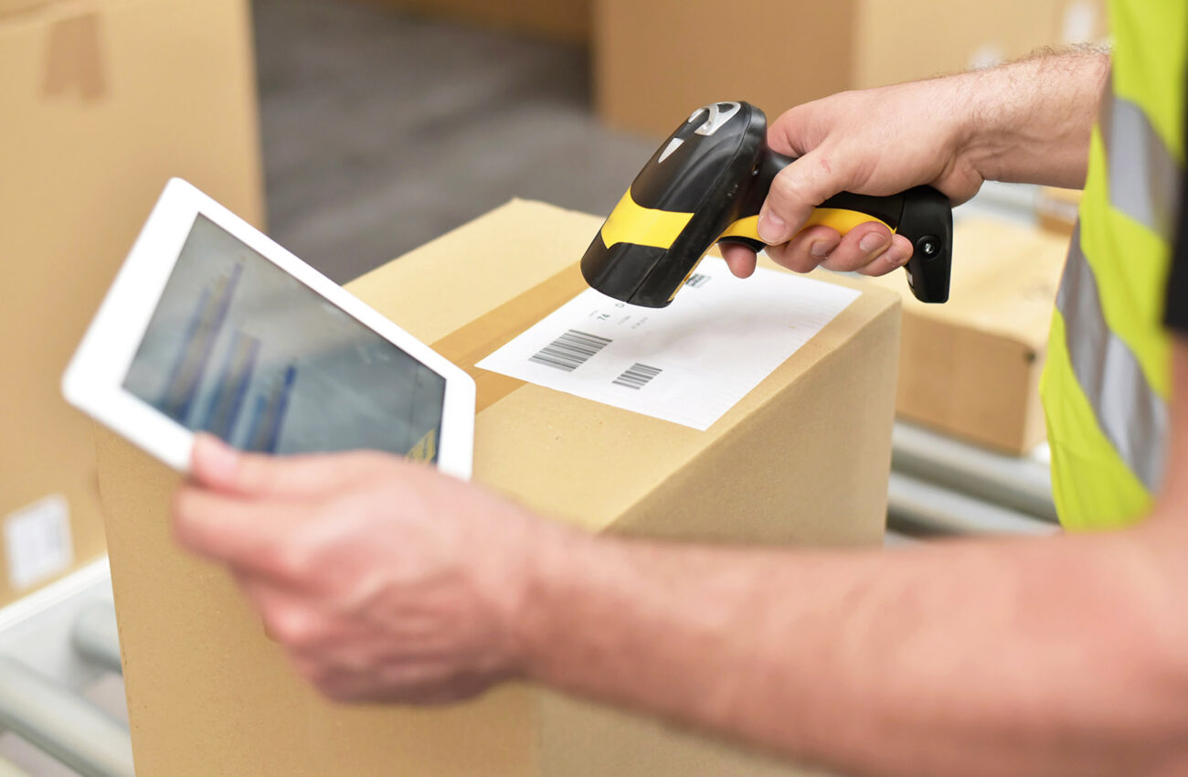 workers in the warehouse scanning parcels for retail and transpo